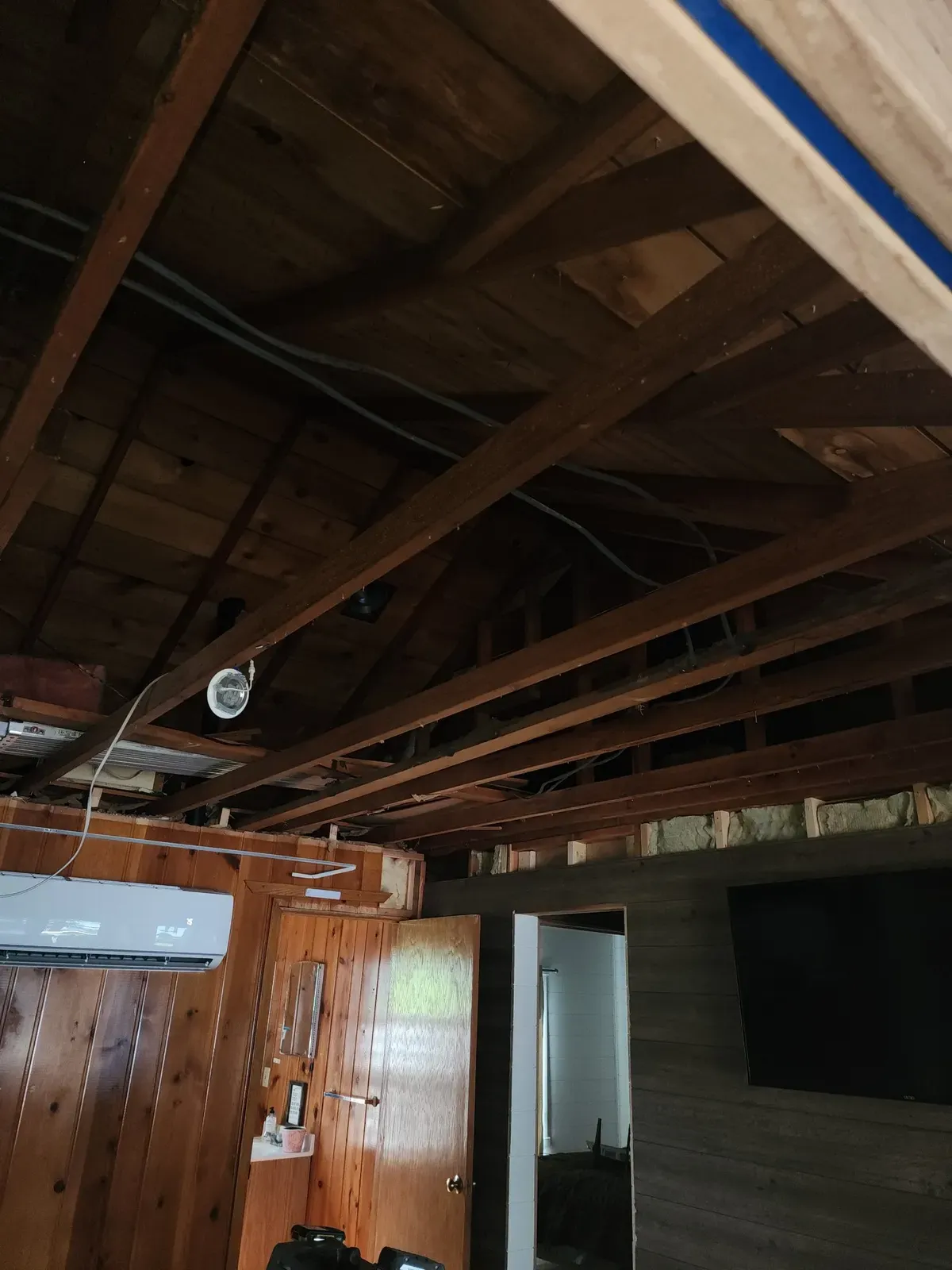 Ceiling demo during the cabin remodel