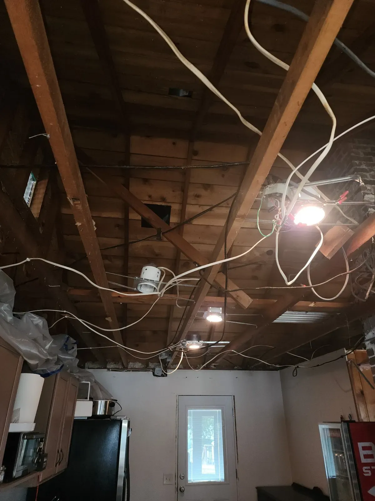 Kitchen ceiling demo during the cabin remodel