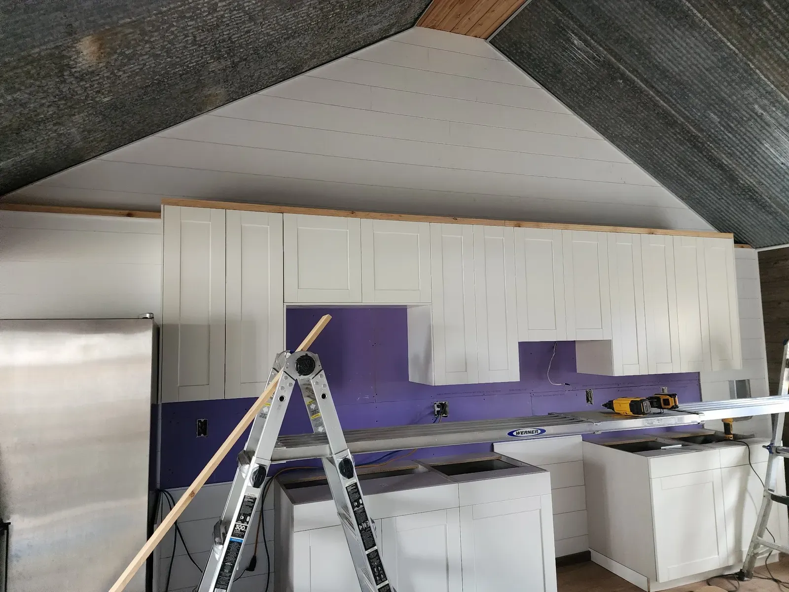 Cabinet wall installation during the cabin remodel