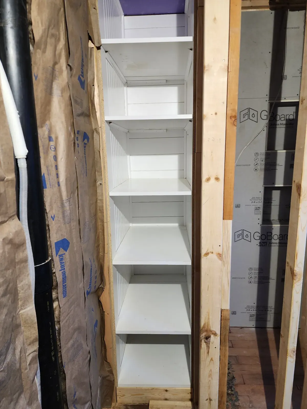 Built-in shelving installation during the cabin remodel