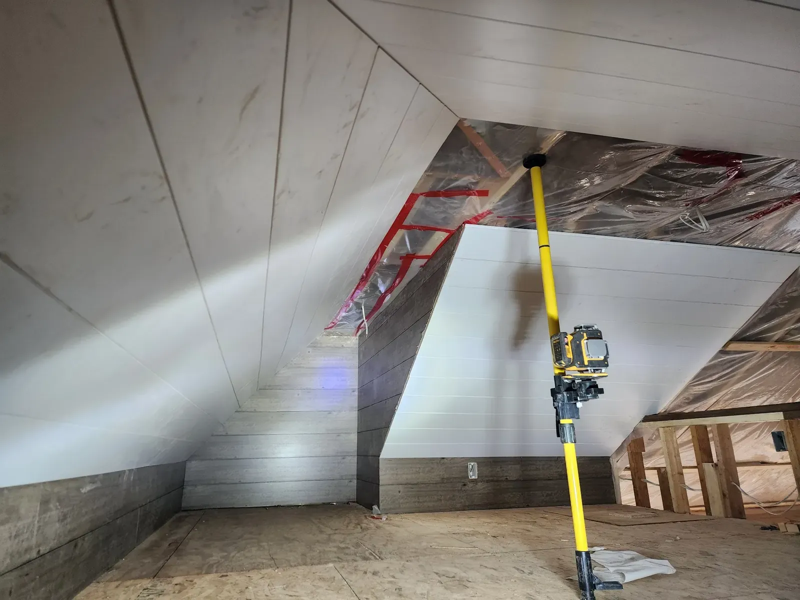 Sloped ceiling paneling during the cabin remodel