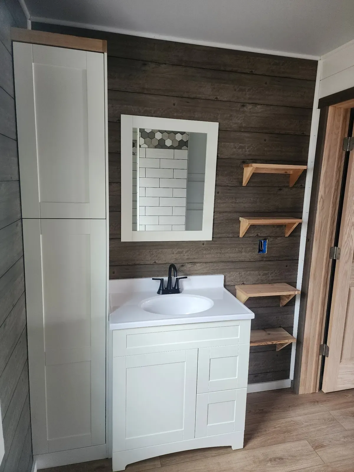 Bathroom vanity and shelves after the cabin remodel