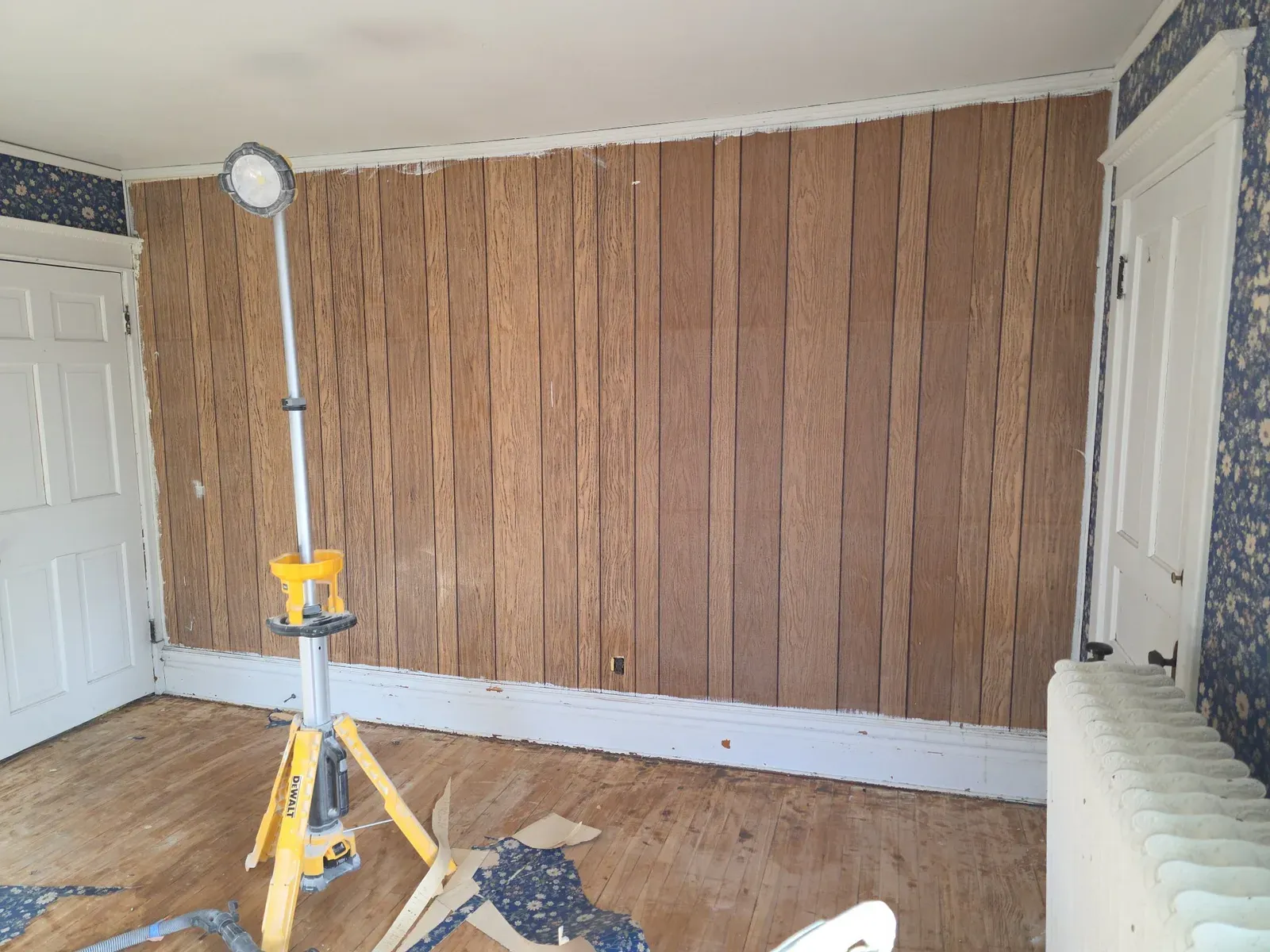 Interior room with wood paneling before renovation