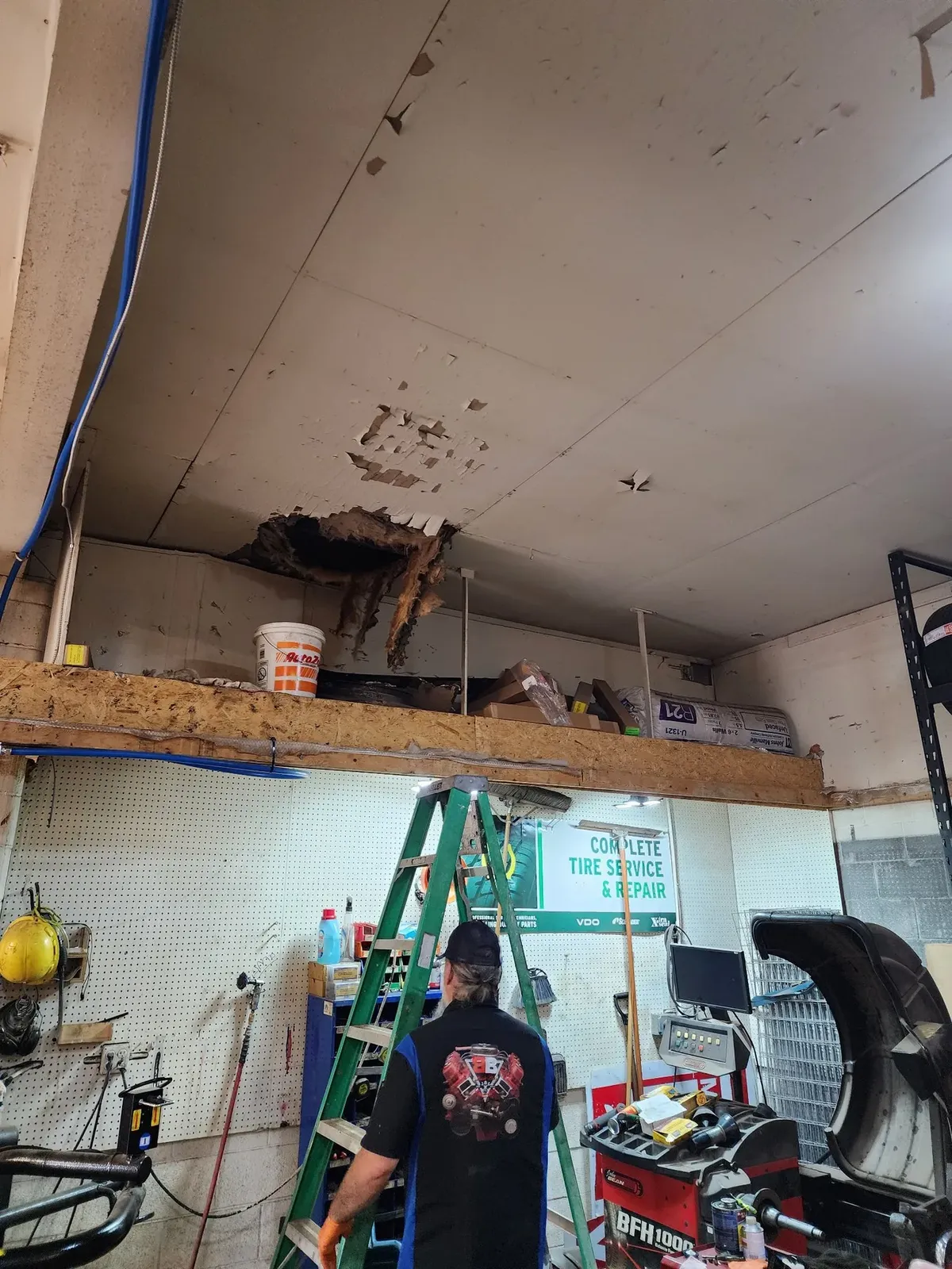 Damaged garage ceiling before the hockey performance center build-out