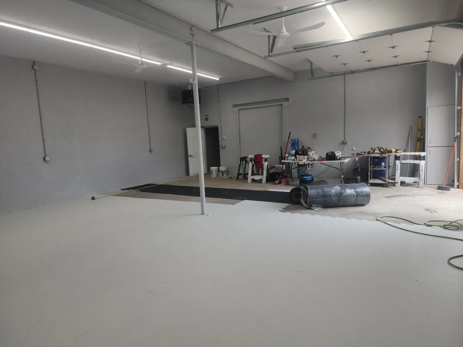 Flooring installation during the hockey performance center build-out