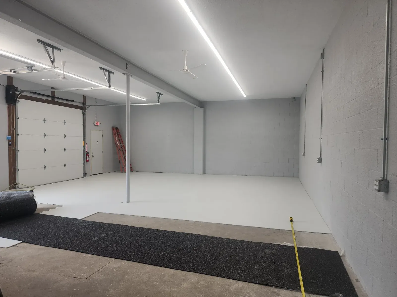 Hockey training bay with new walls and lighting while the flooring is rolled out