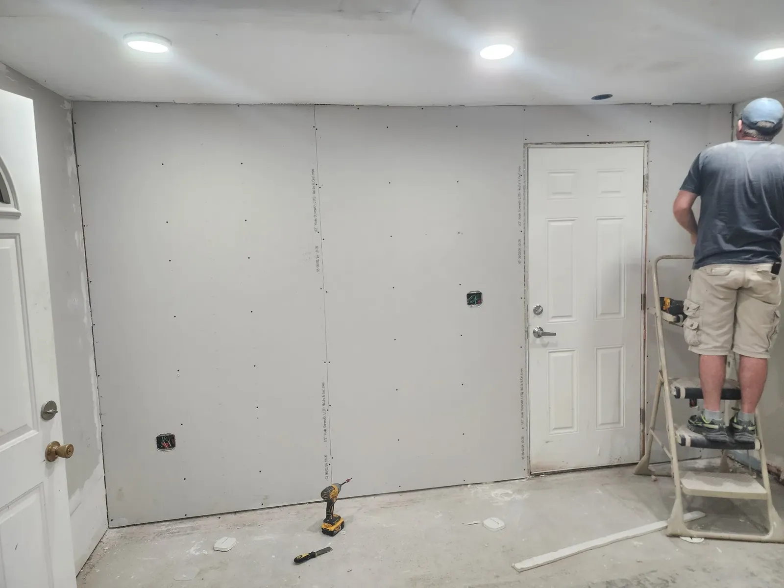Drywall room with a ladder during the hockey performance center build-out