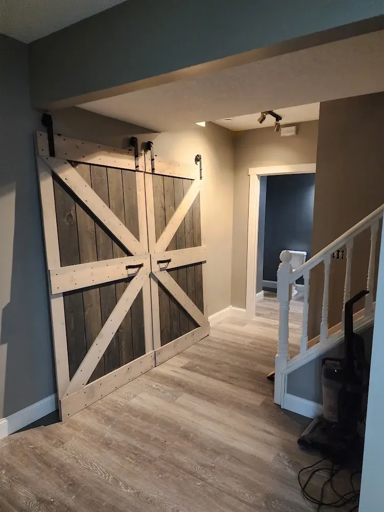 Finished basement hallway with barn doors