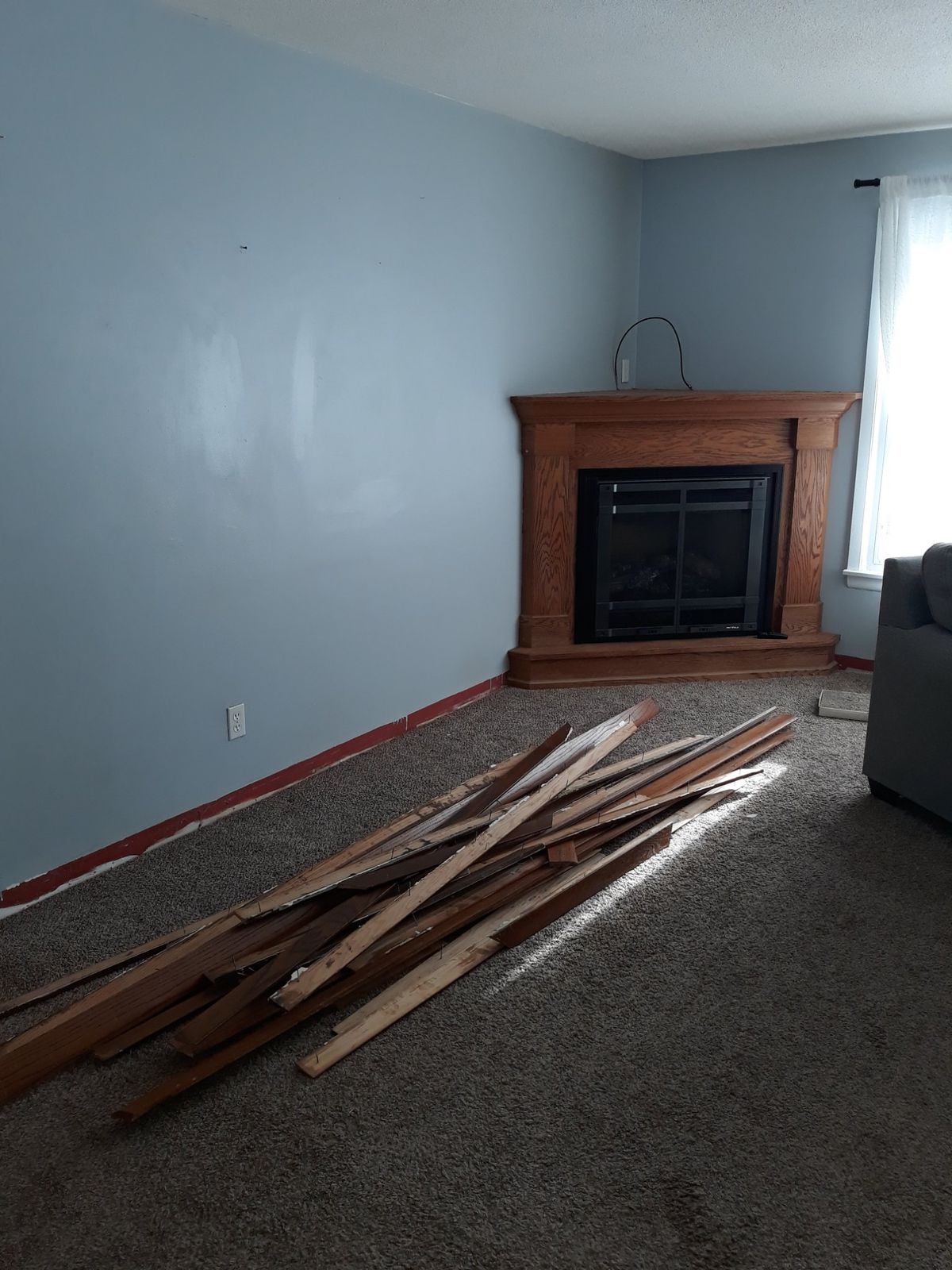 Living room and fireplace before the main-floor remodel