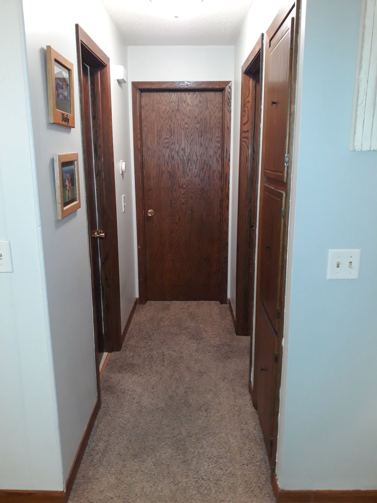 Main-floor hallway after the walls and trim were painted during the remodel