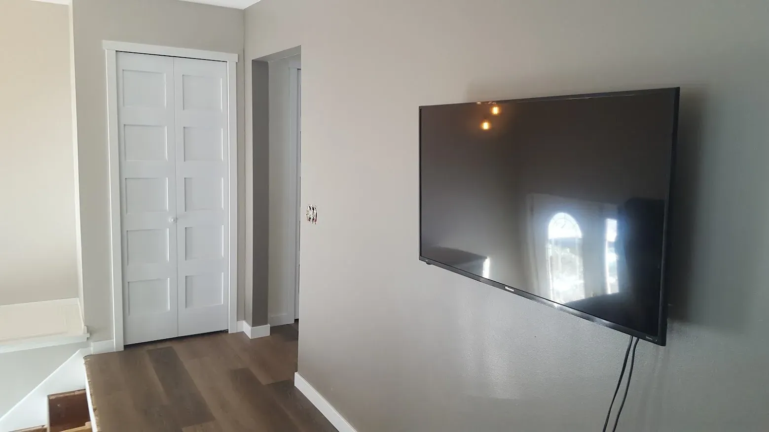 Finished living room with refinished flooring and fresh paint