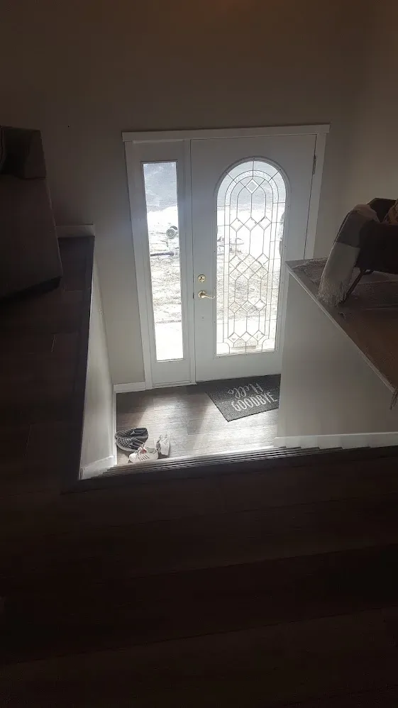 Newly installed entry door with bright white trim