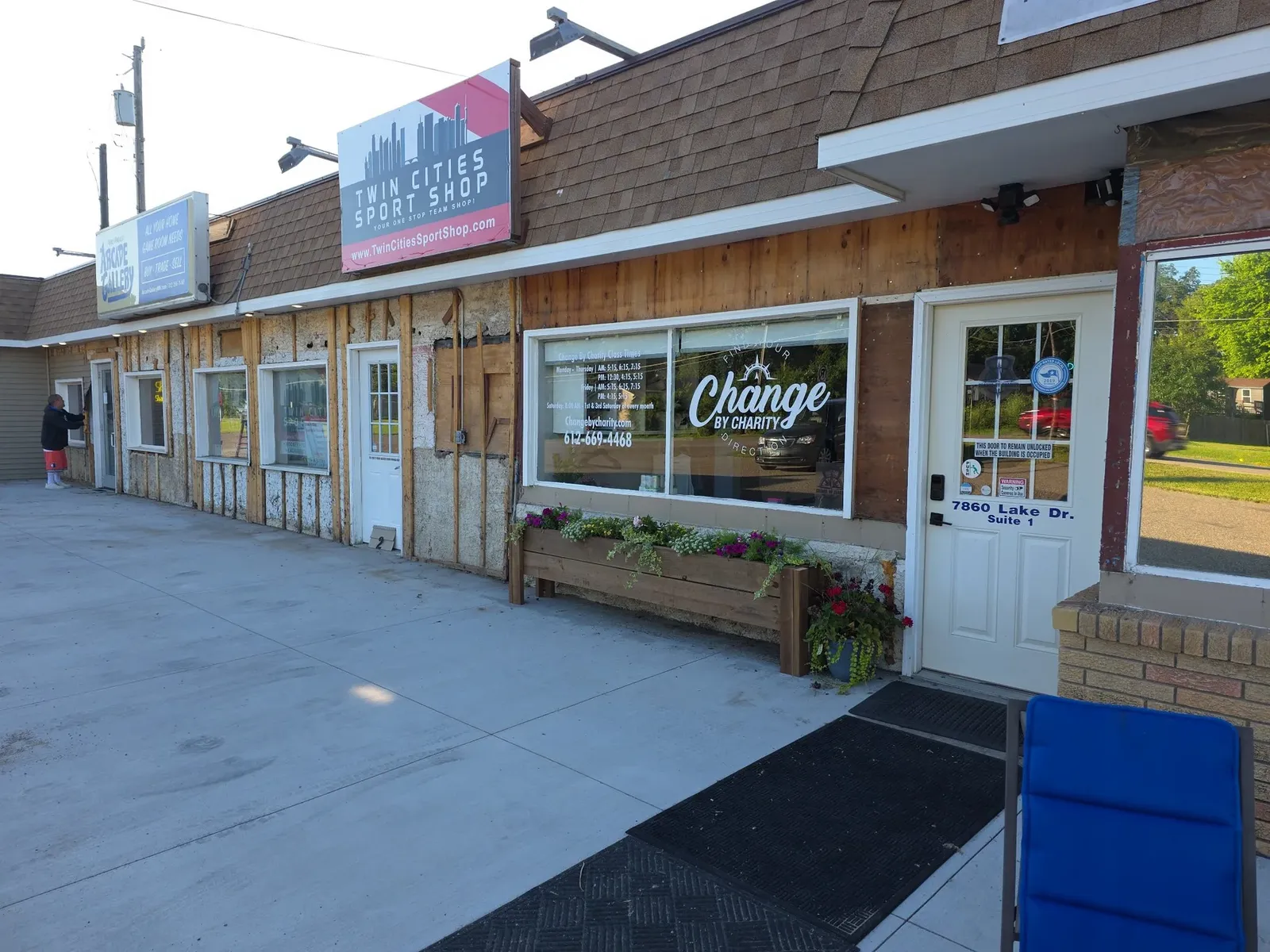 Performance center storefront stripped down to the sheathing during the re-siding