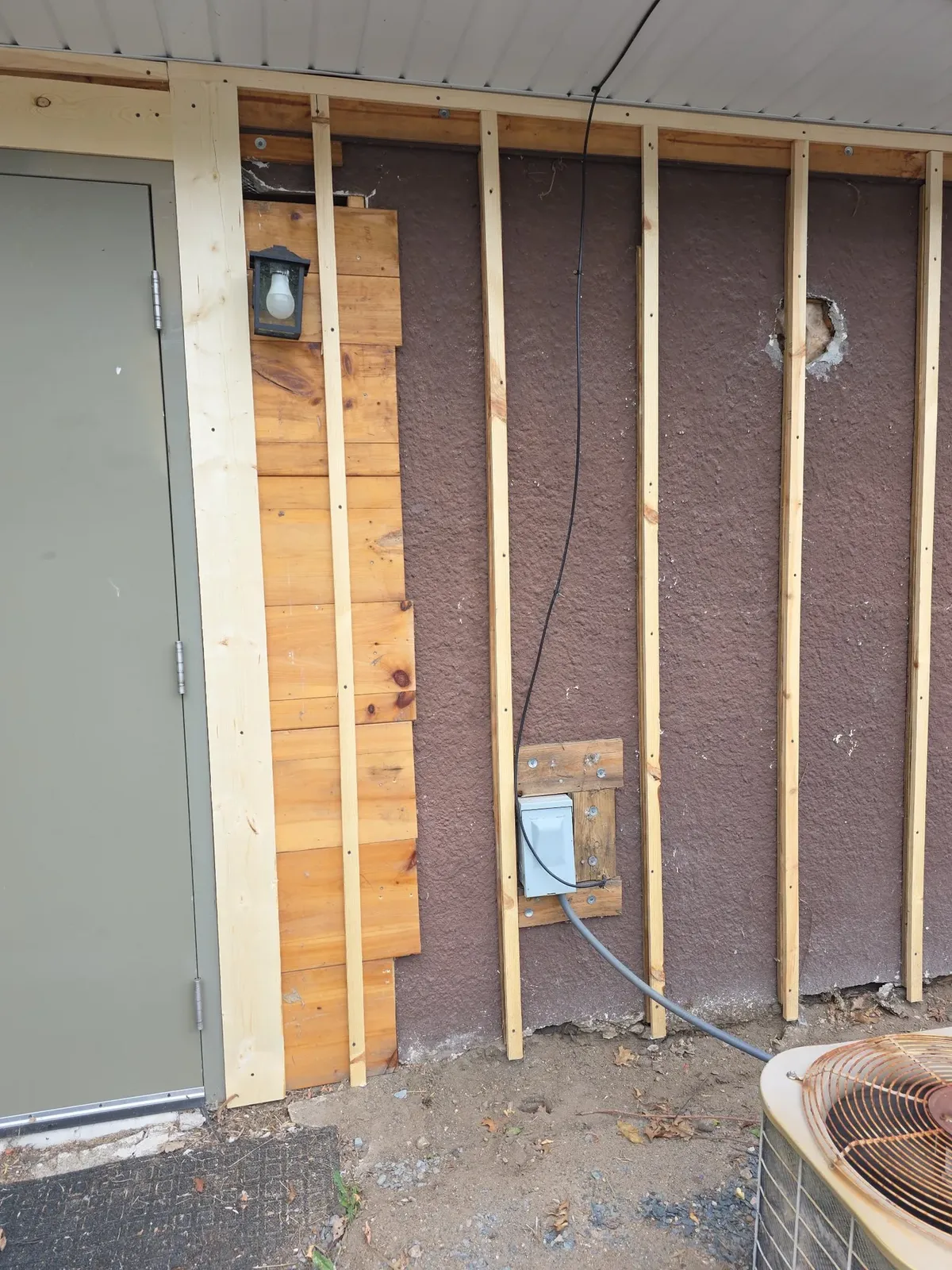 Exterior wall framing and sheathing exposed during renovation
