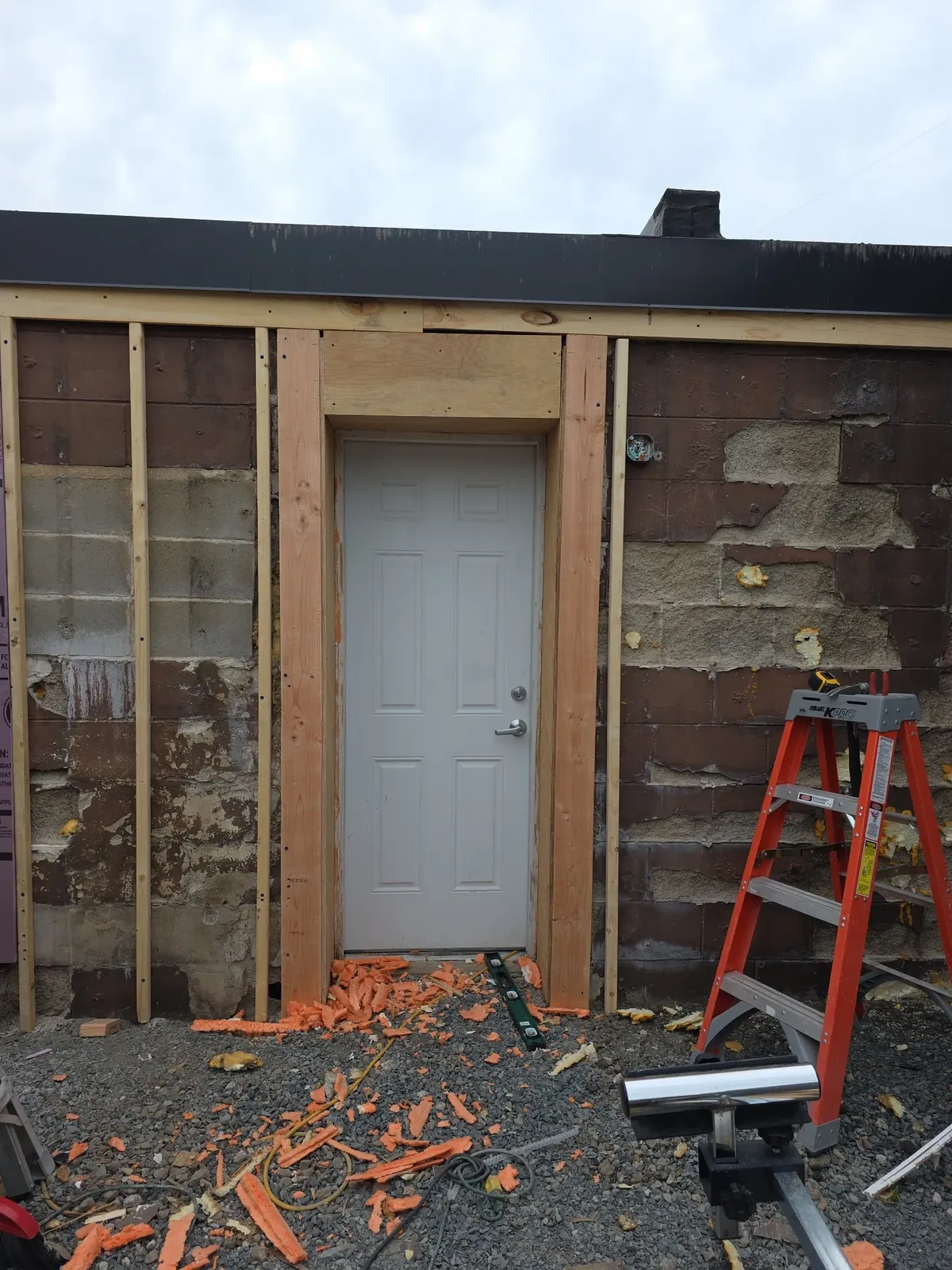 Wide view of the rear door area during the performance center exterior renovation