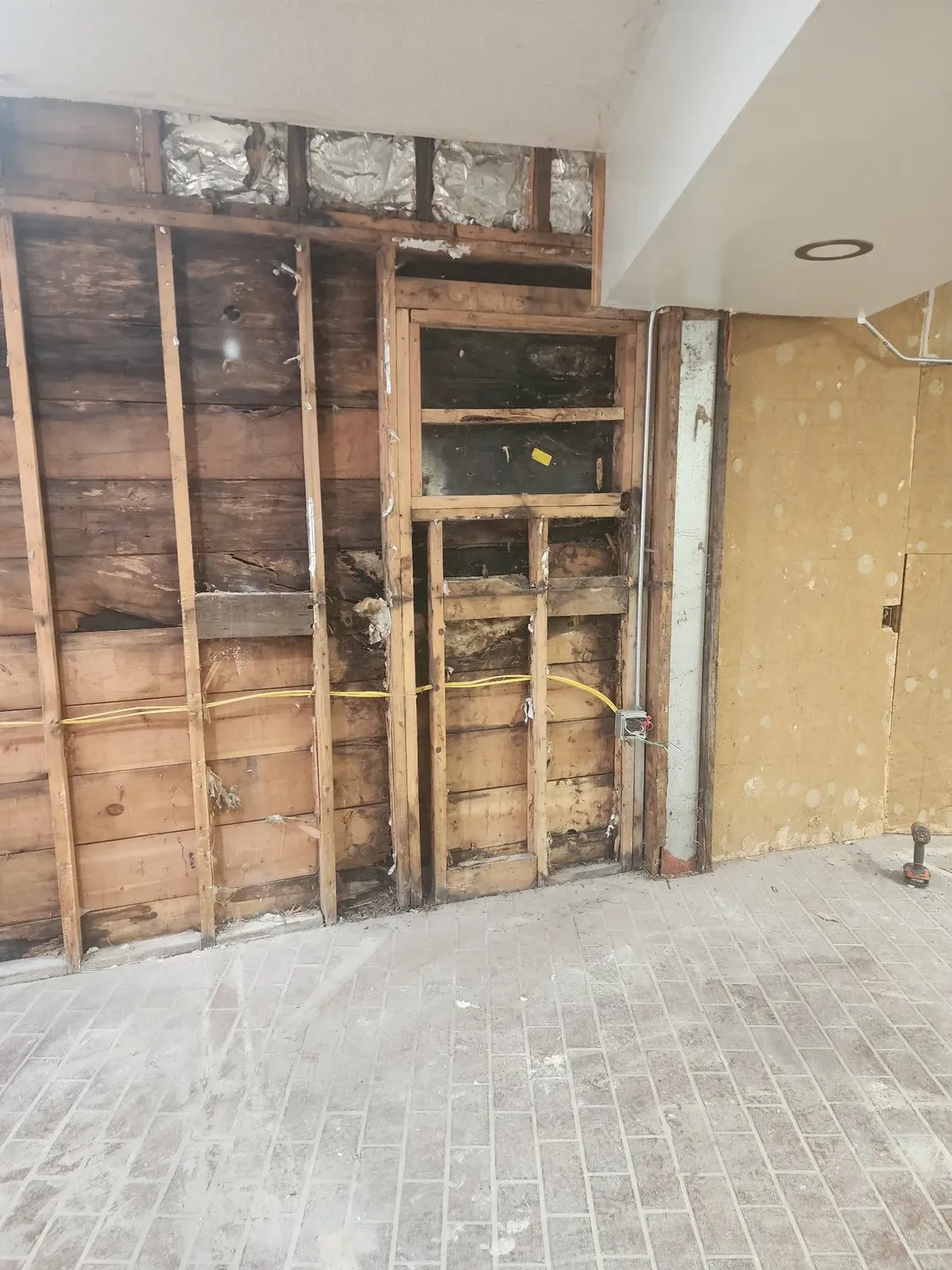 Exposed wall framing before the commercial gym build-out