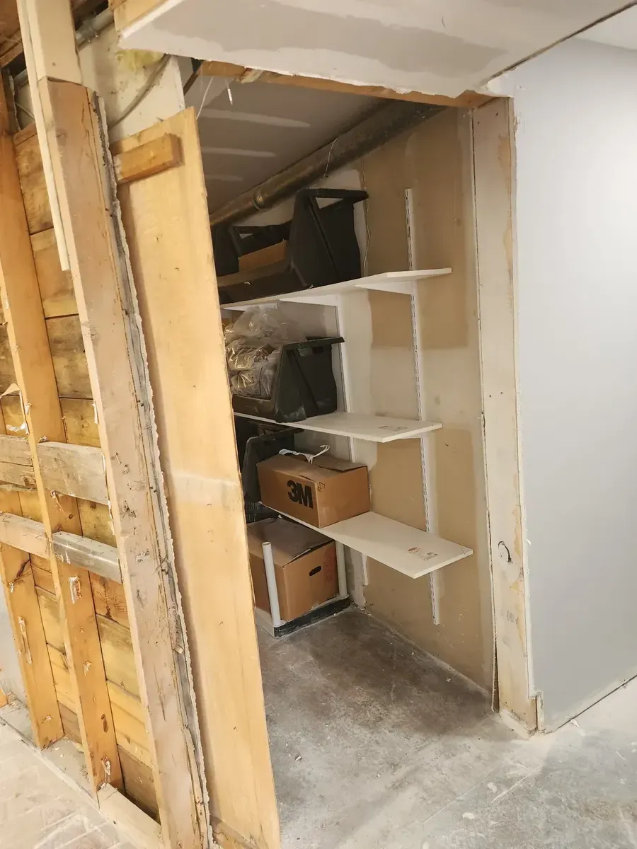 Built-in shelving exposed during demolition of the commercial gym